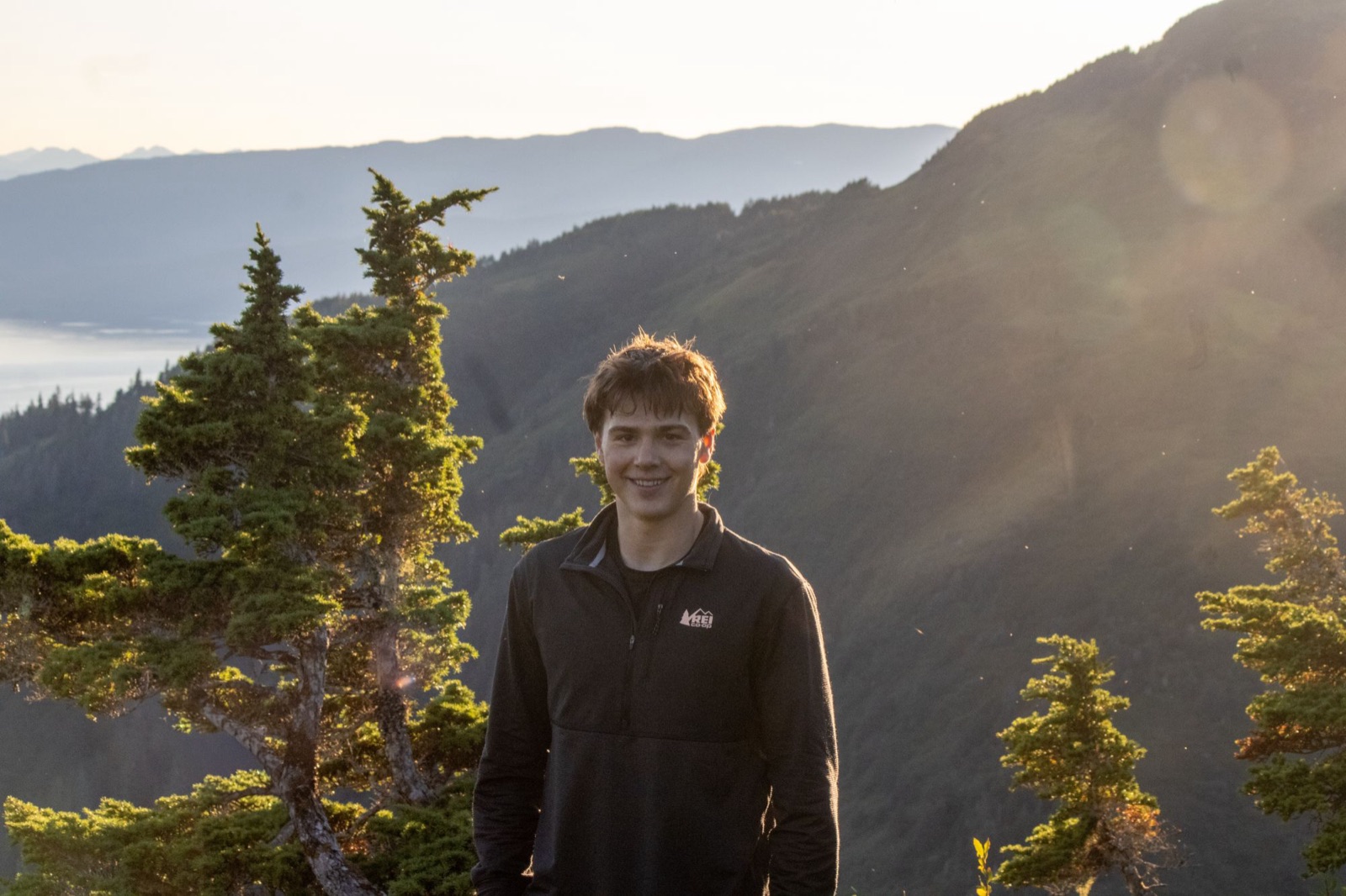 Maddox Carroll on a ridge above Juneau at sunset